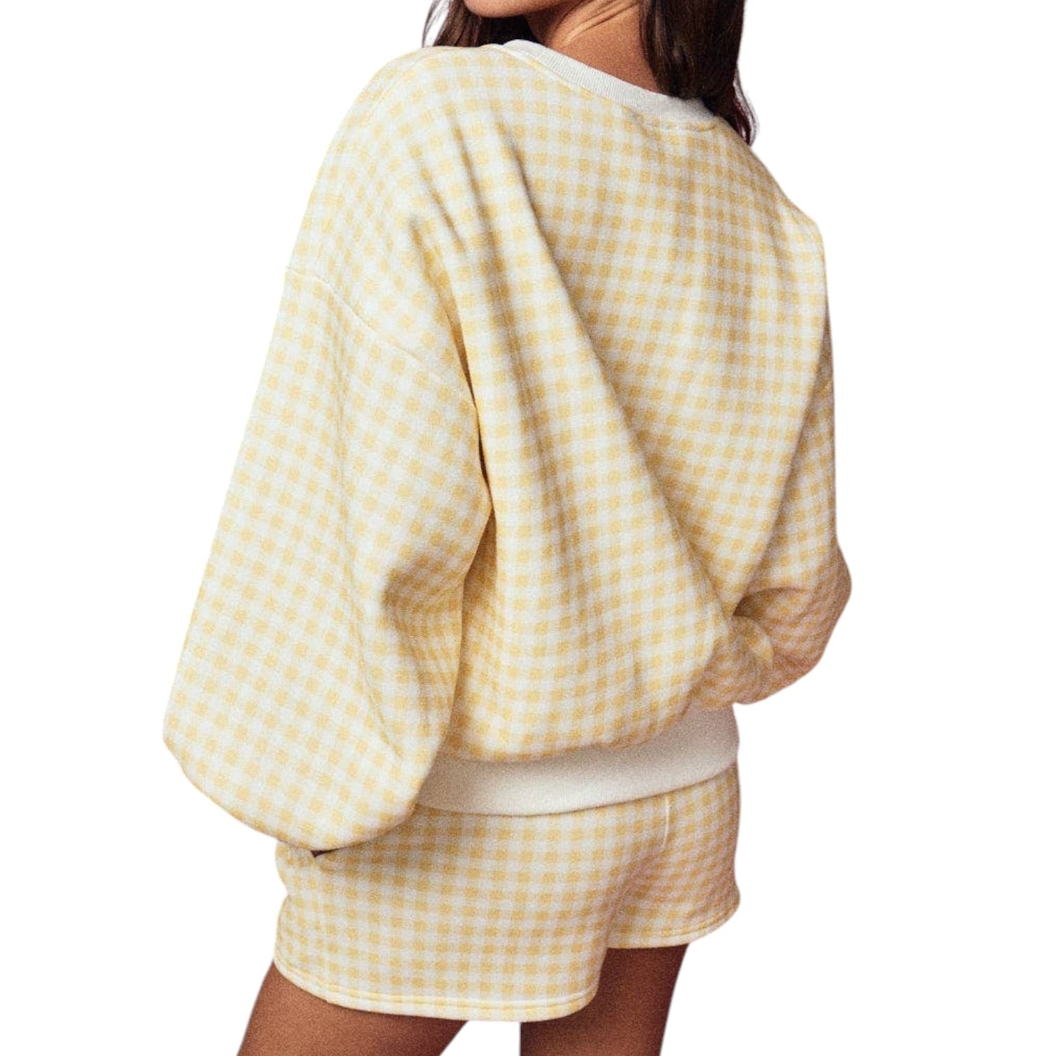Yellow and white checkered outfit on a plain background