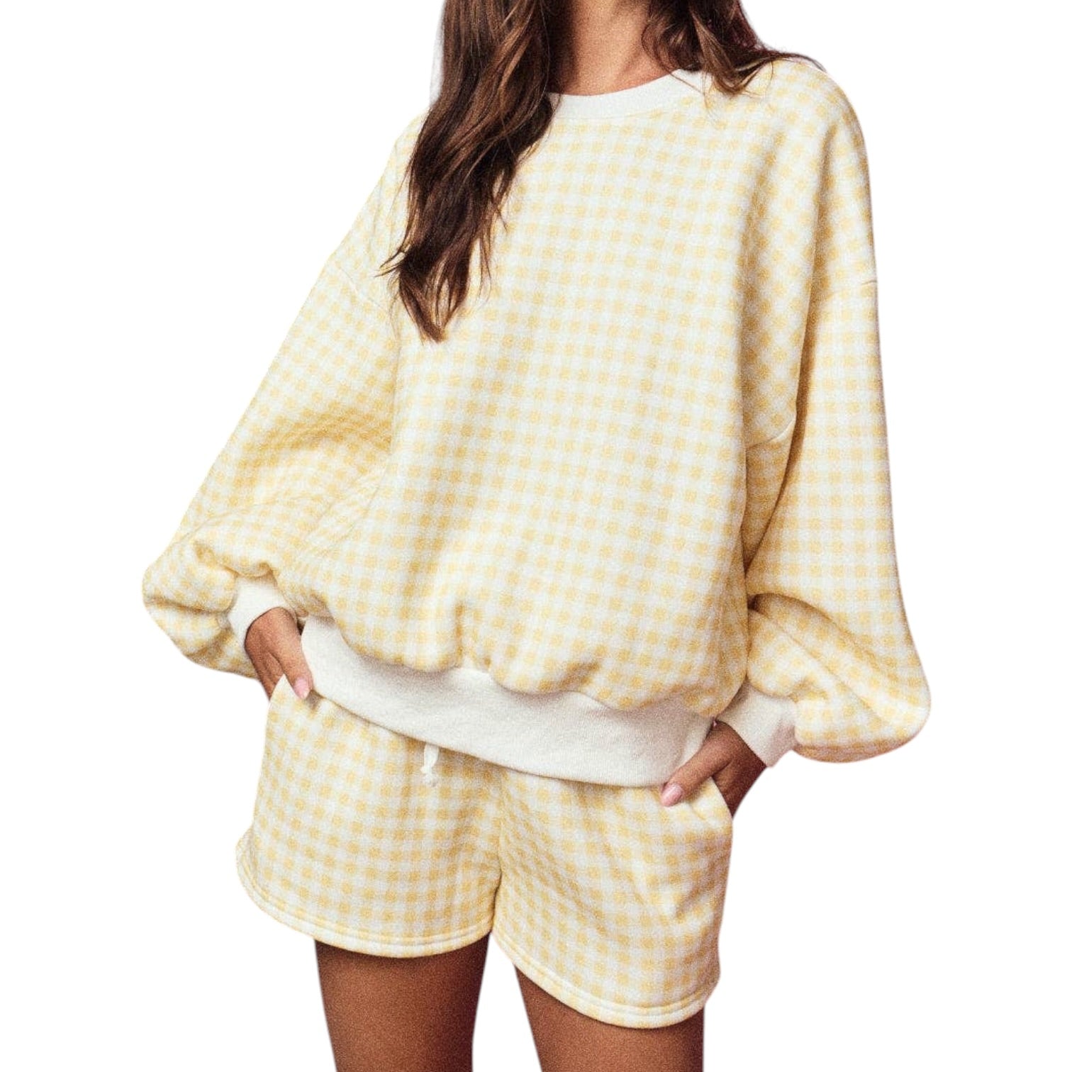 Person wearing a yellow checkered outfit on a white background