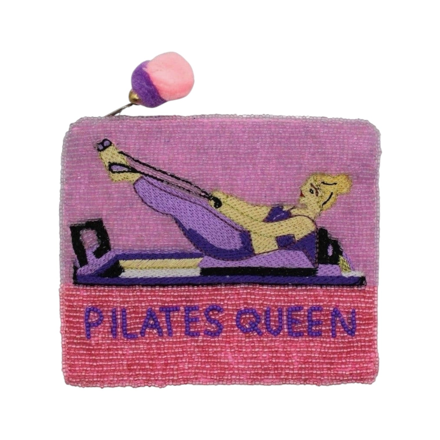 A square embroidered patch featuring a Pilates queen on a reformer machine, with the text 'PILATES QUEEN' embroidered in purple on a pink section at the bottom. The patch is primarily pink and purple with yellow and black details, and has a small pink and purple pom-pom loop on the top edge.