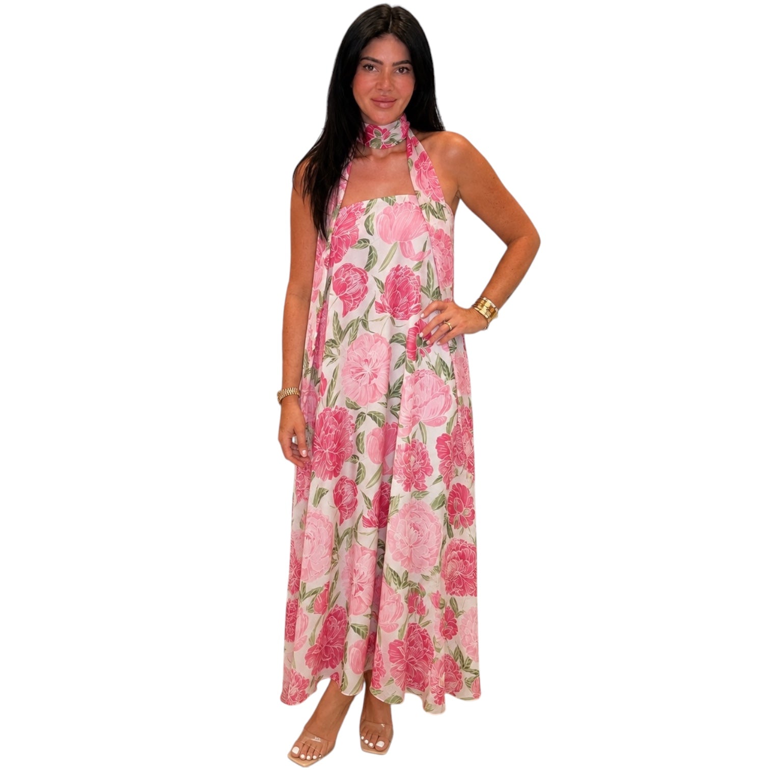 Woman wearing a pink floral dress on a white background