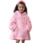 A young girl wearing a pink plush hooded robe with an allover bow pattern and a matching pink headband, photographed against a plain white background.
