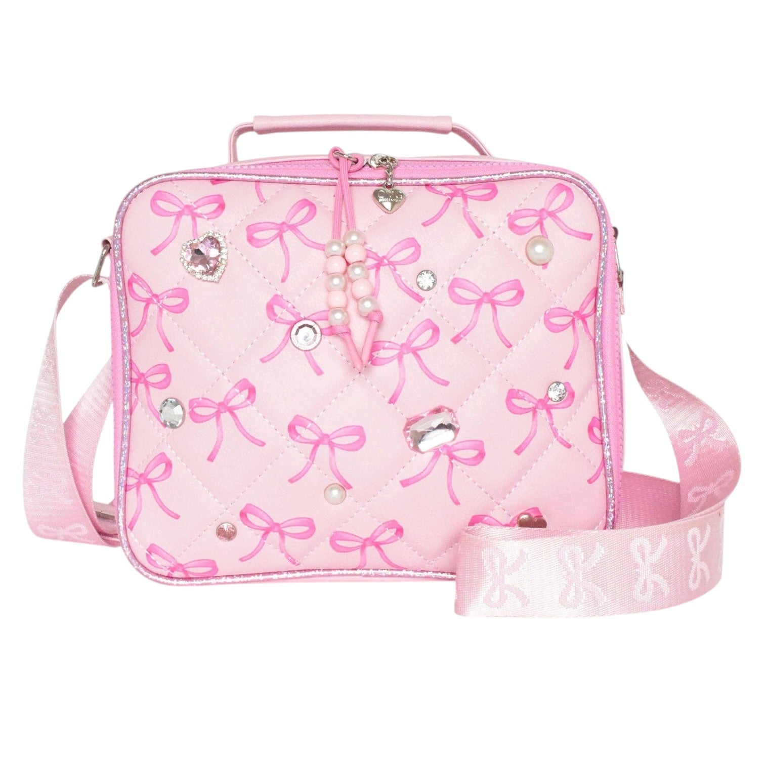 A pink quilted lunch bag decorated with pink bow patterns, rhinestones, and faux pearls, featuring a top handle and a detachable shoulder strap on a white background.