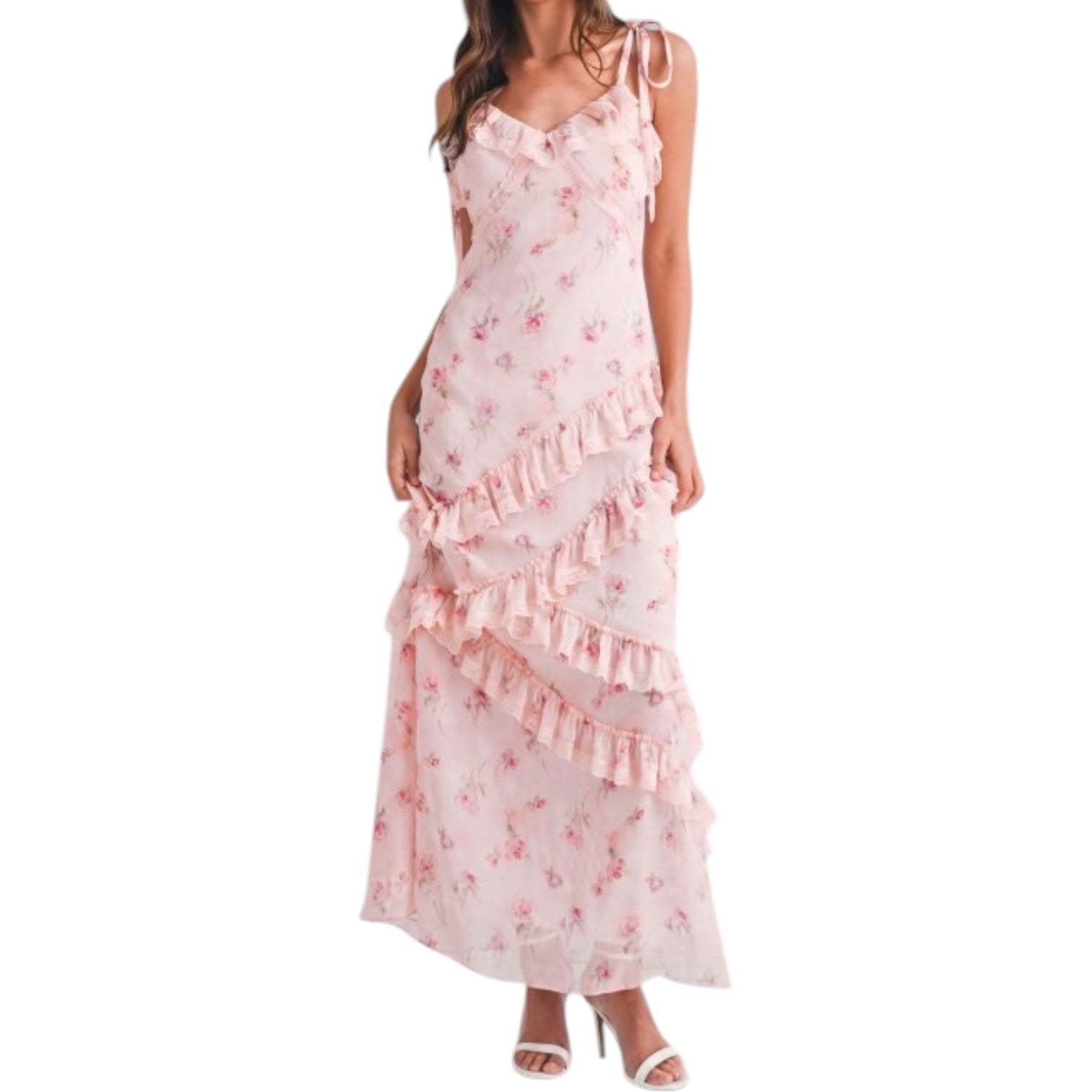 a woman wearing a pink floral dress with ruffles on white background