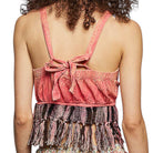 Pink top with fringes and a tie detail on a white background