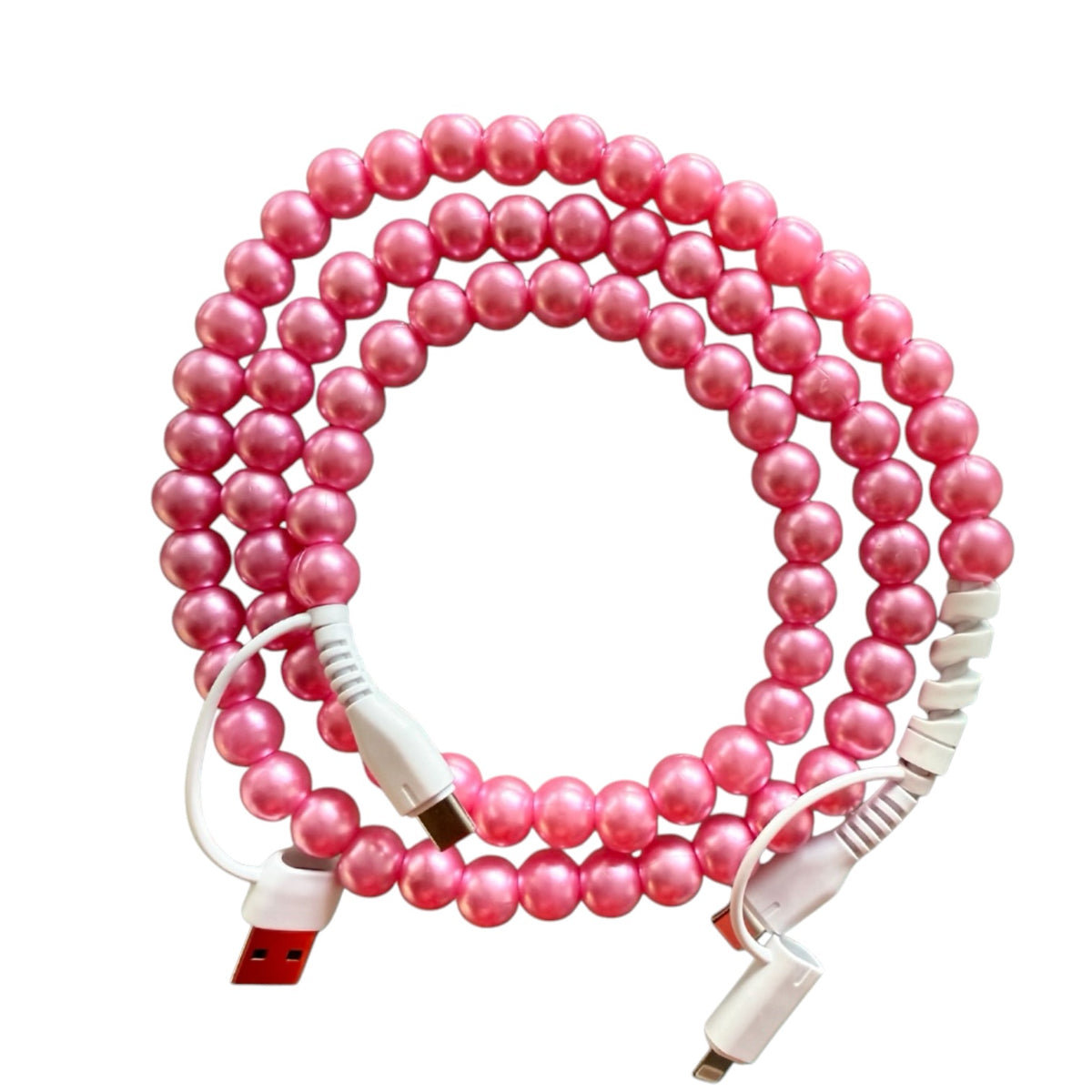 A pink beaded USB charging/data cable coiled in a loop, featuring white USB-A to Micro-USB connectors with pink pearl-like beads throughout.