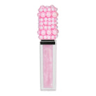 A lip gloss tube with a decorative cap made of pink pearls and beads, containing a sparkly light pink gloss, shown on a plain white background.