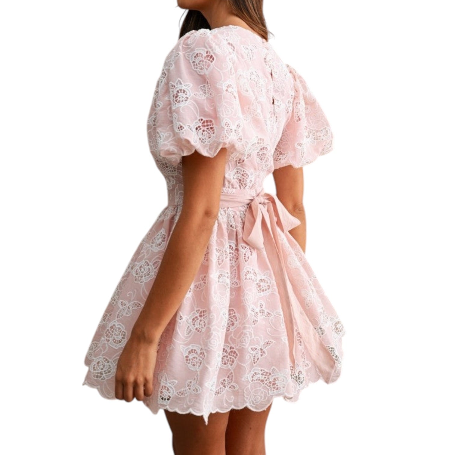 Pink lace dress with puff sleeves on a white background