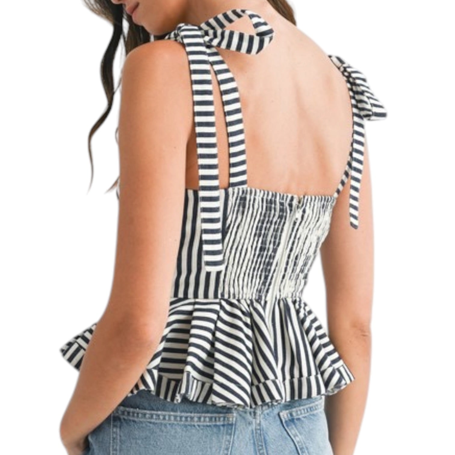 Black and white striped peplum top with bow details on a white background