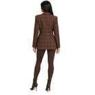 A woman shown from the back wearing a brown plaid blazer, matching brown leggings, and dark brown ankle boots against a plain white background.