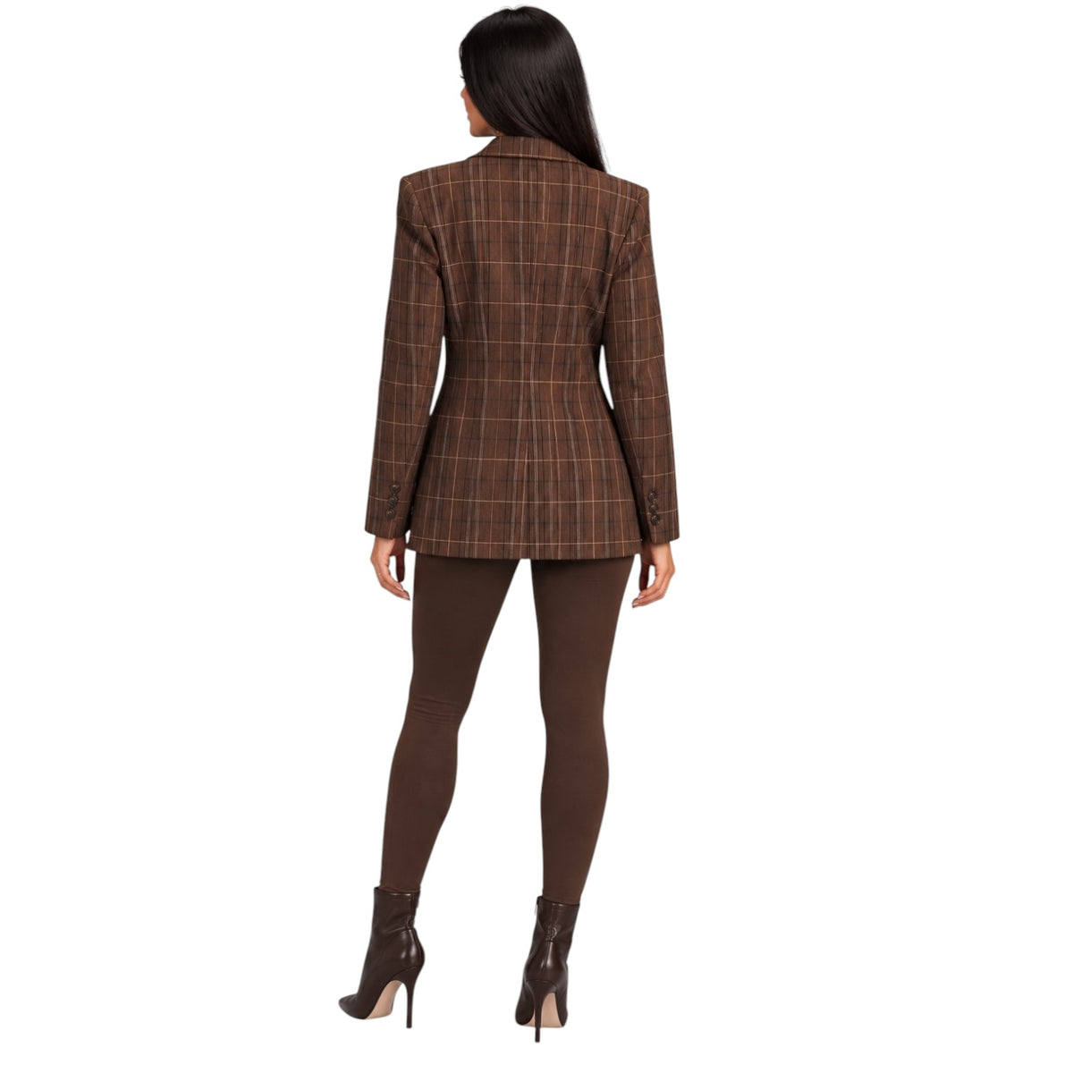 A woman shown from the back wearing a brown plaid blazer, matching brown leggings, and dark brown ankle boots against a plain white background.