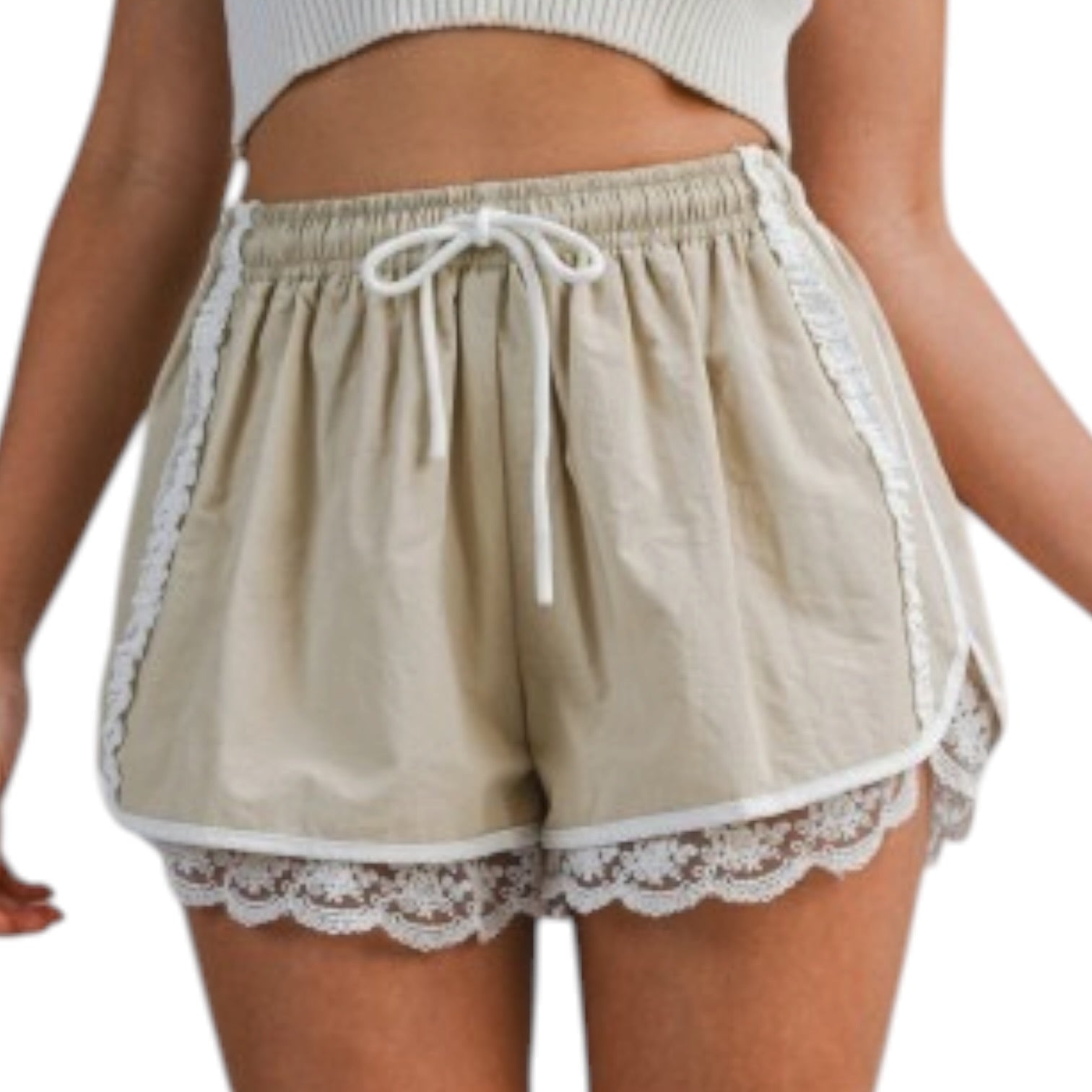 woman wearing beige shorts with white lace trim