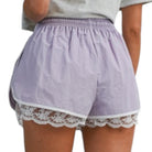 woman wearing lavender shorts with white lace trim