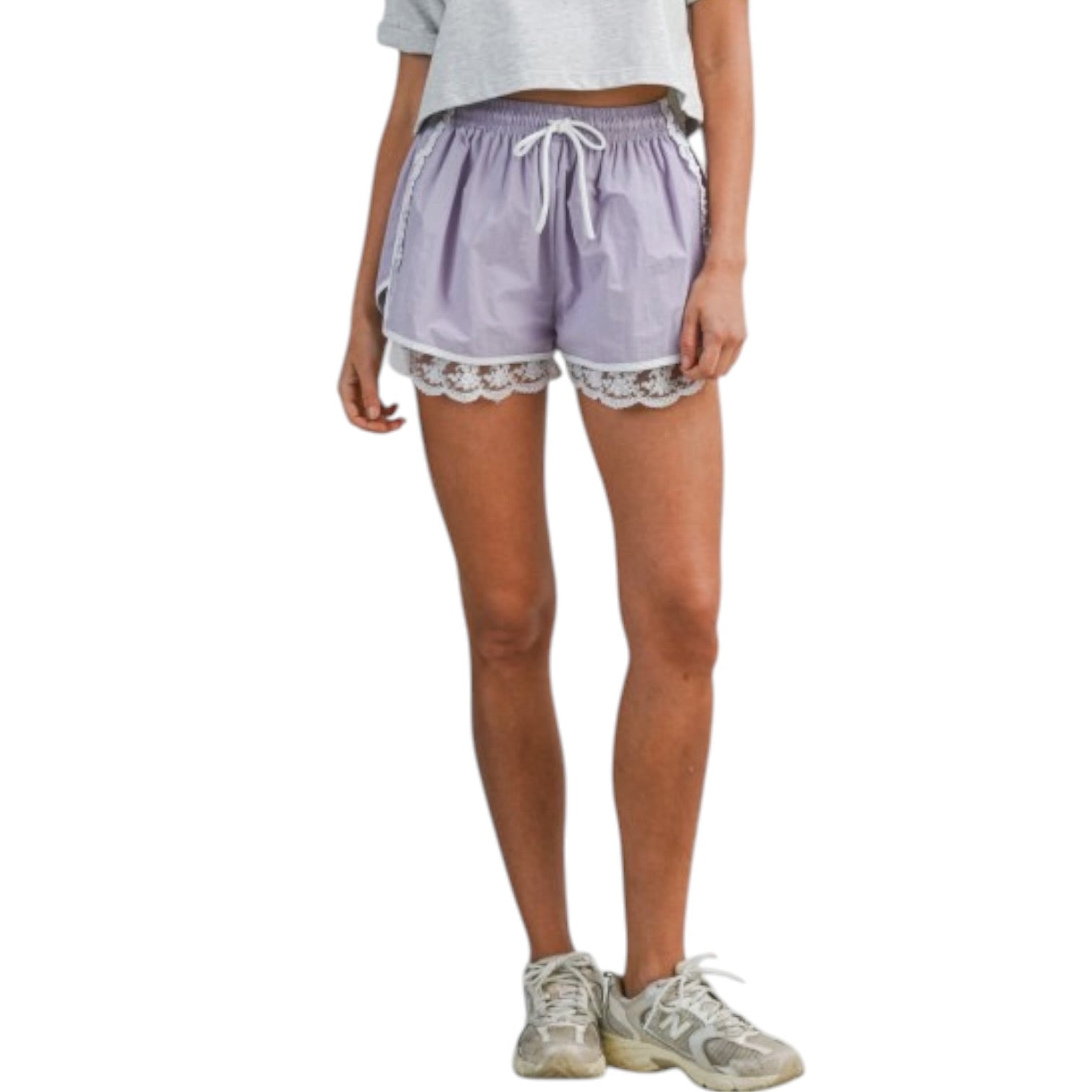 woman wearing lavender shorts with white lace trim