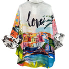 Colorful shirt with a scenic print and the word 'love' on a white background