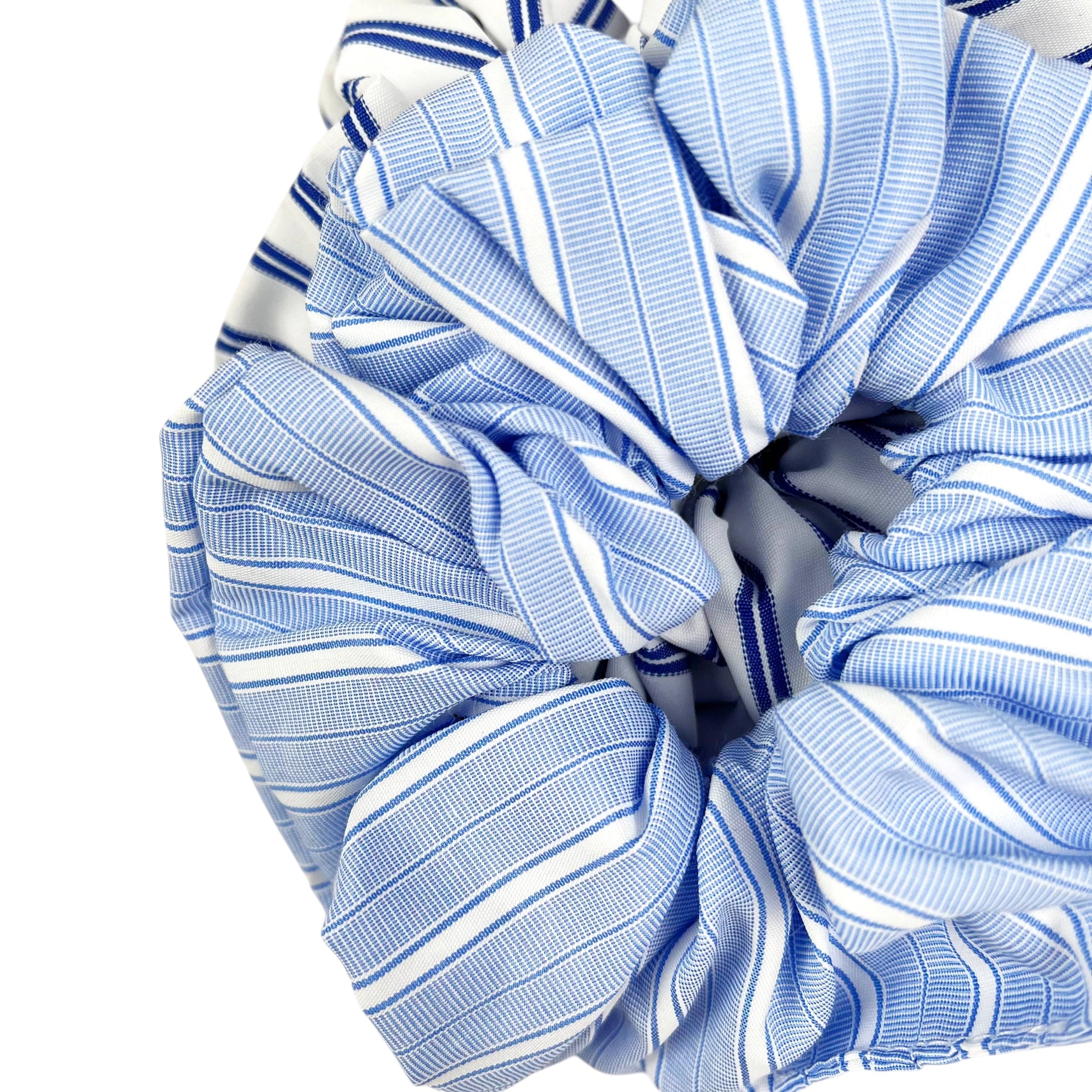 Close-up of blue and white striped fabric on a white background