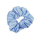Blue and white striped scrunchie on a white background