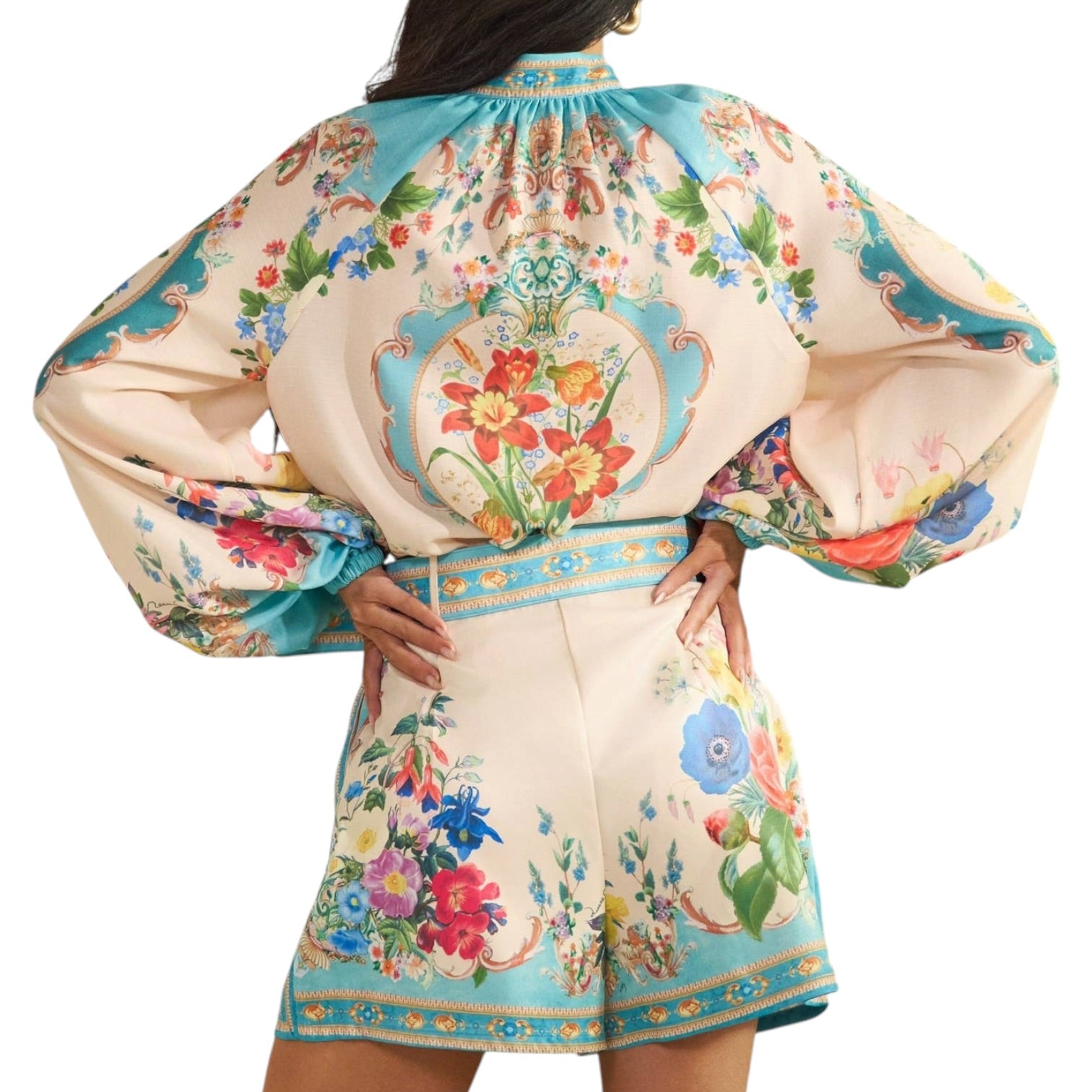 woman wearing a patterned short set on white background