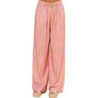 Pink and beige striped pants on a white background