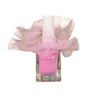 A bottle of pink nail polish with a white cap, wrapped in a sheer pink tulle bow. The brand name 'bebearte' is visible on the front of the bottle.