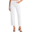 a woman wearing white jeans on a white background