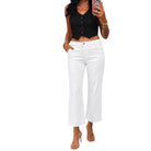 a woman wearing white jeans on a white background