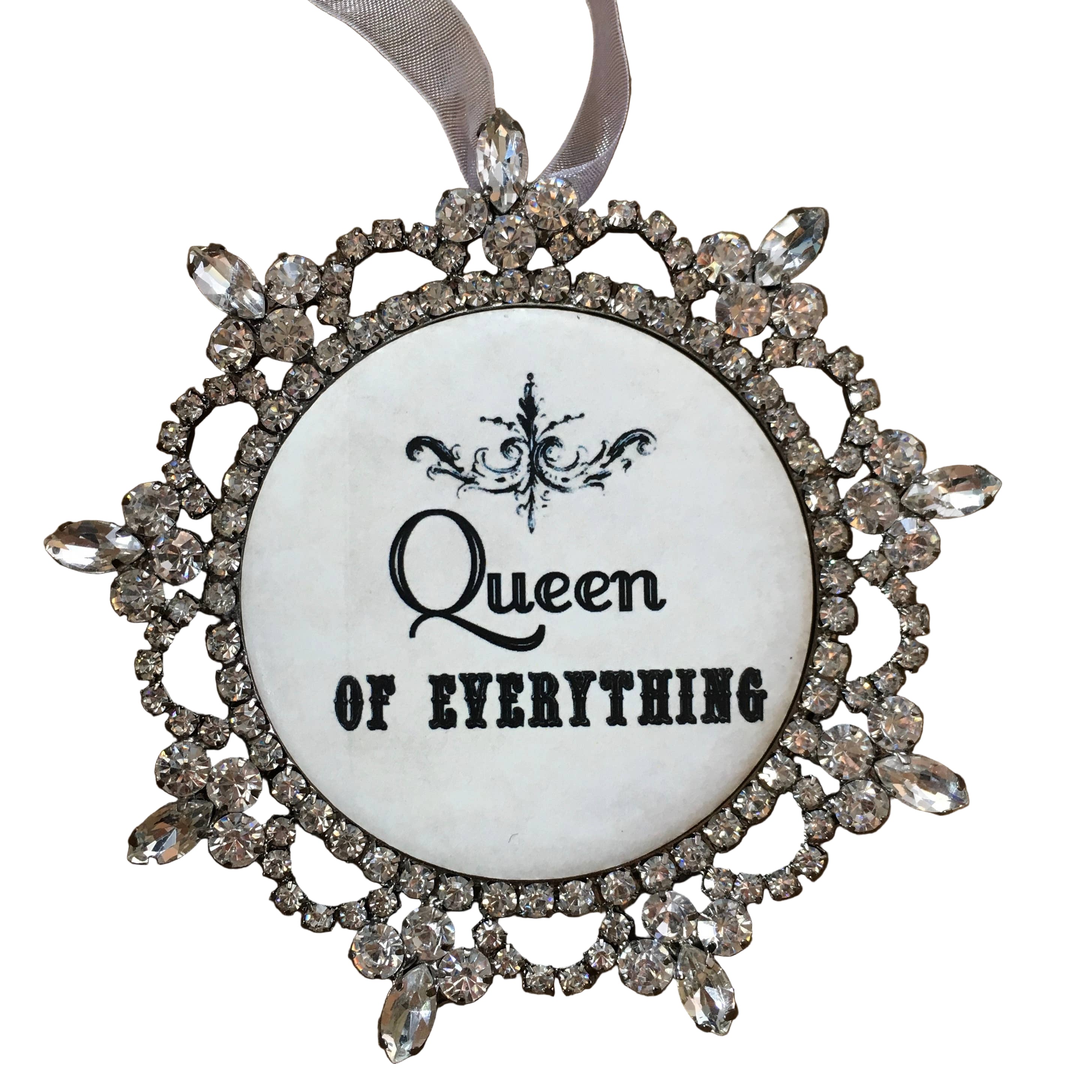 Decorative ornament with 'Queen of Everything' text and rhinestone frame on a white background