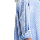 Close-up of a blue and white striped shirt with a transparent overlay