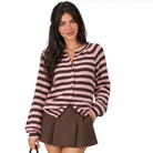 A woman modeling a pink and dark brown striped knit cardigan with long sleeves and a button front, paired with a brown pleated mini skirt, against a plain white background.
