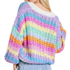 Multicolored crochet sweater worn by a person on a white background