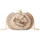 twist straw clutch crossbody bag on white background