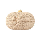 khaki twisted straw clutch bag on white background