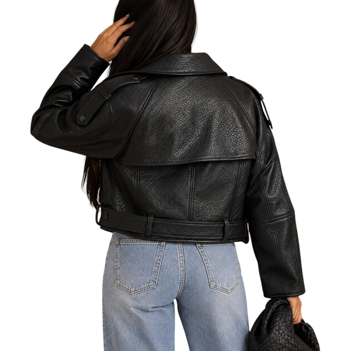 A woman shown from the back wearing a black textured faux-leather moto jacket with a belted waist, paired with light blue jeans, against a plain white background.