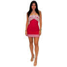 Woman wearing a red and white dress on a white background