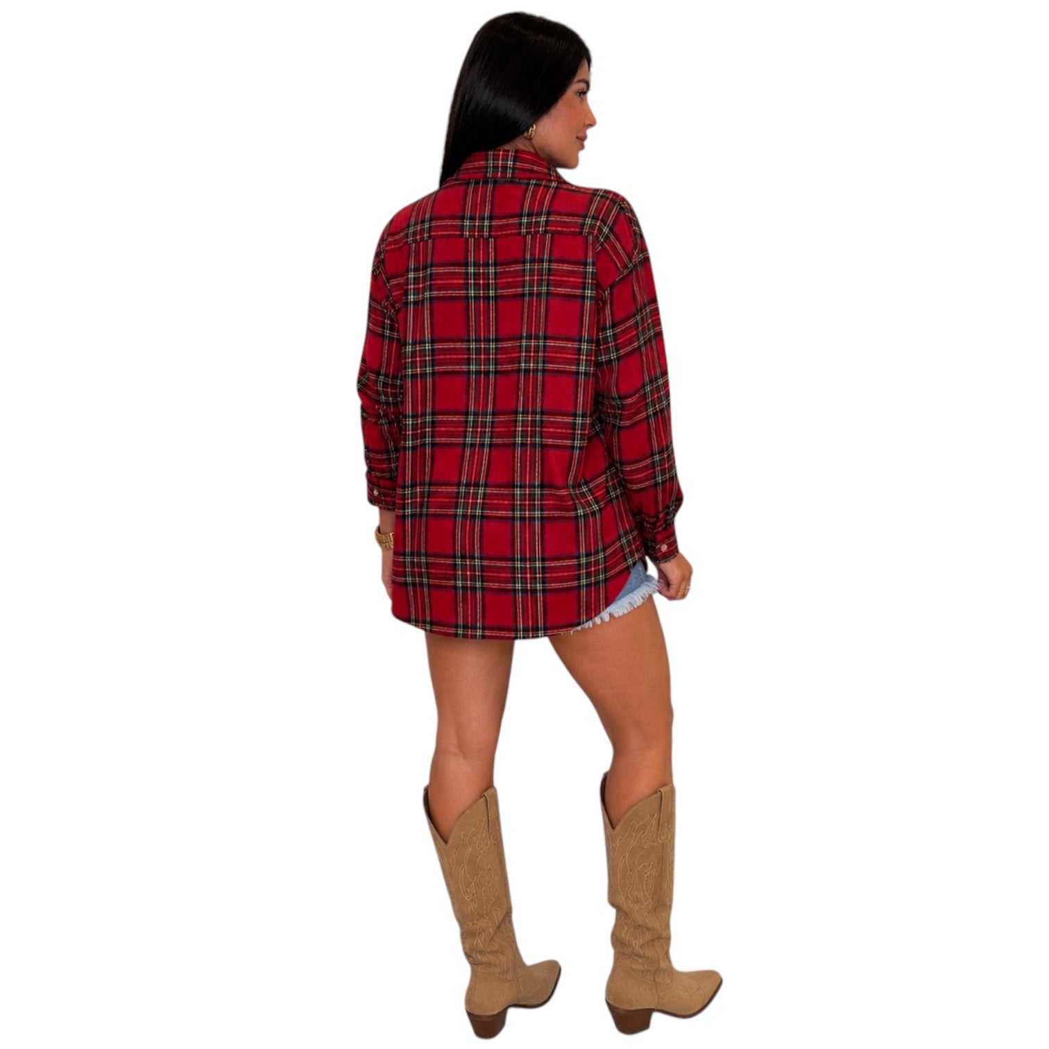 A woman shown from the back wearing a red plaid flannel shirt with black and yellow lines, paired with tan cowboy boots and denim shorts, against a plain white background.