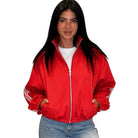 Person wearing a red jacket with white stripes on a white background