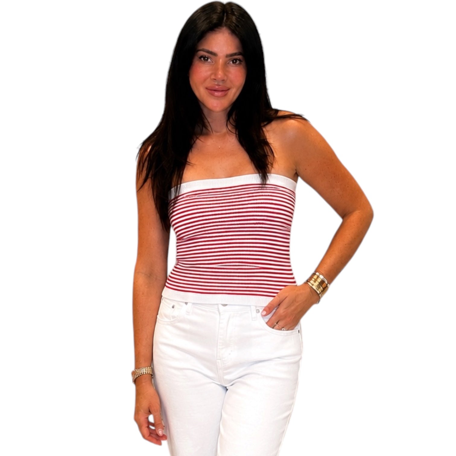Woman wearing a red and white striped top and white pants on a white background