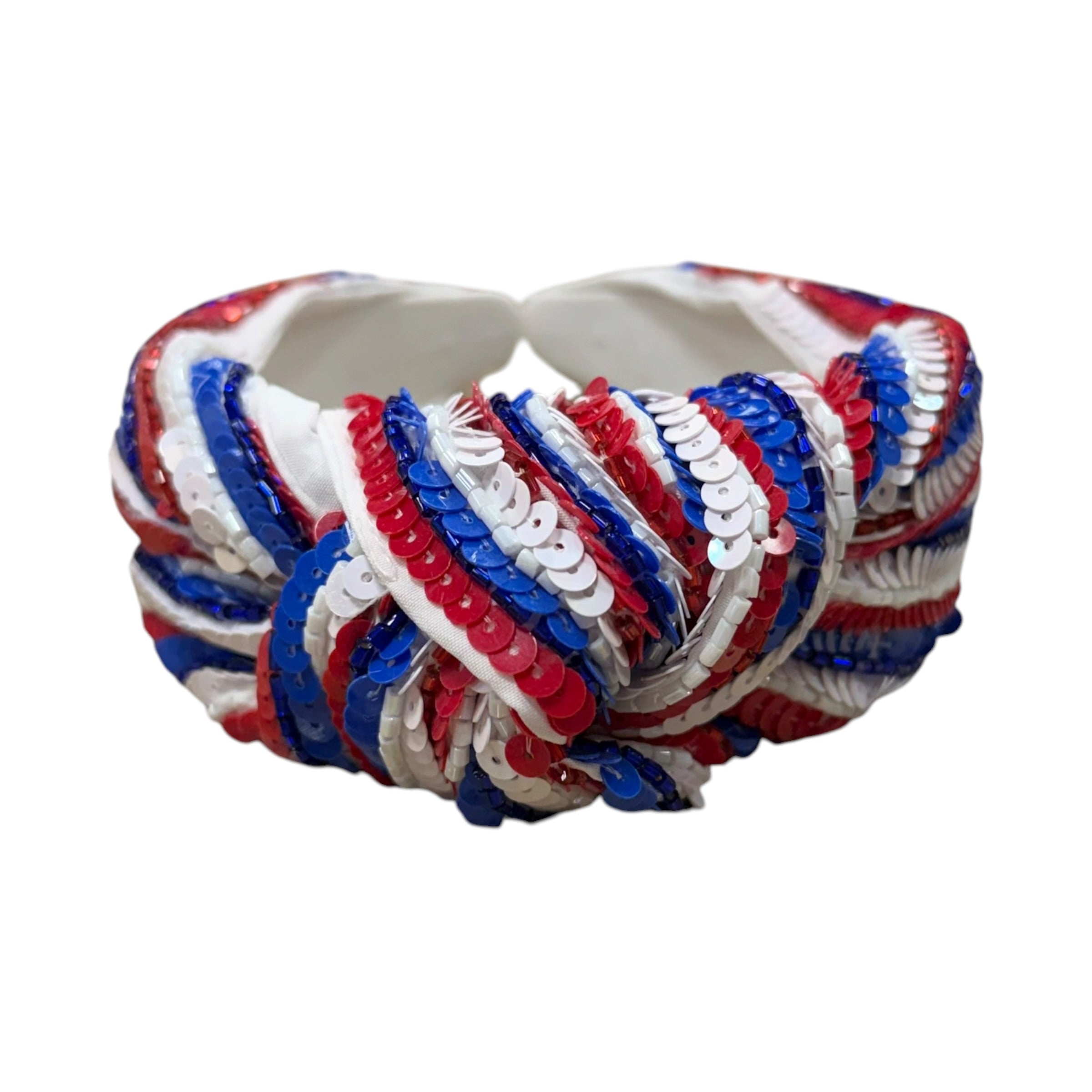 Colorful woven headband with red, white, and blue pattern on a white background