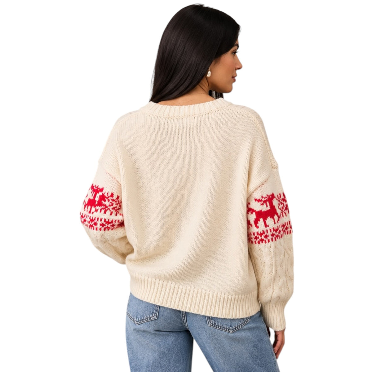 A woman shown from the back wearing a cream knit sweater with red holiday reindeer patterns on the sleeves, paired with blue jeans, against a plain white background.