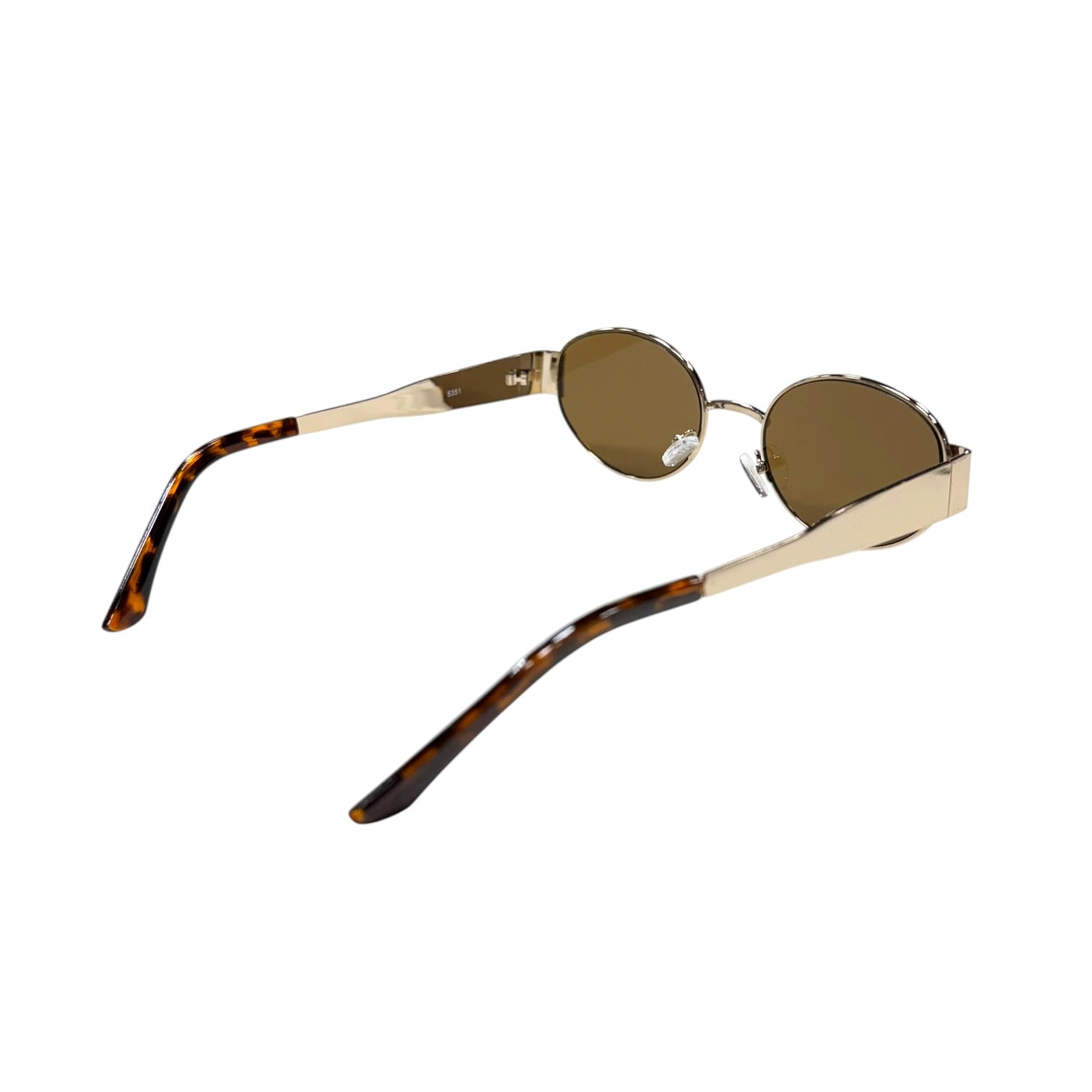Sunglasses with tortoiseshell arms on a white background