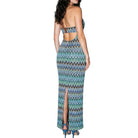 Woman wearing a colorful zigzag patterned dress on a white background