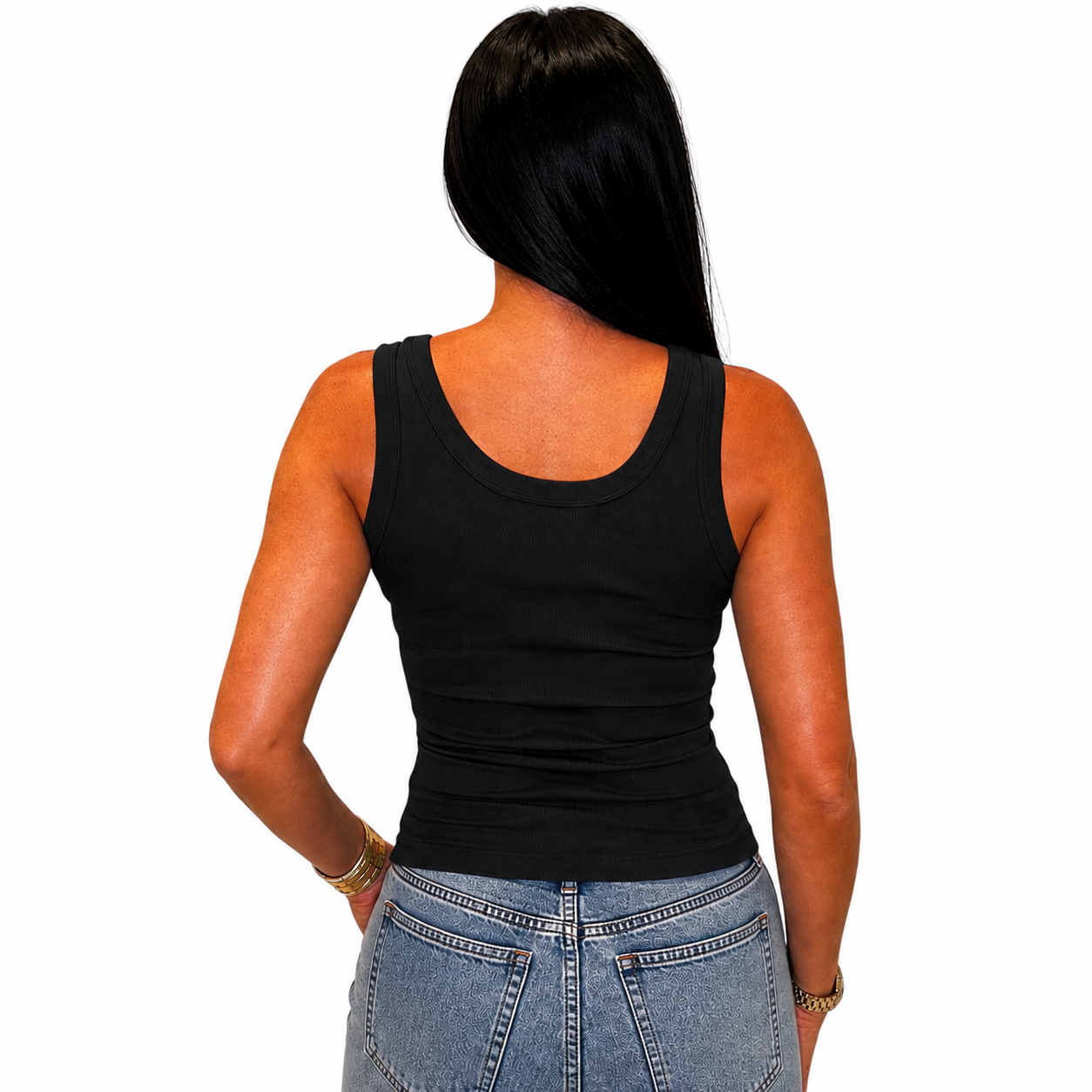 A woman viewed from the back wearing a fitted black sleeveless tank top and light blue jeans against a plain white background.