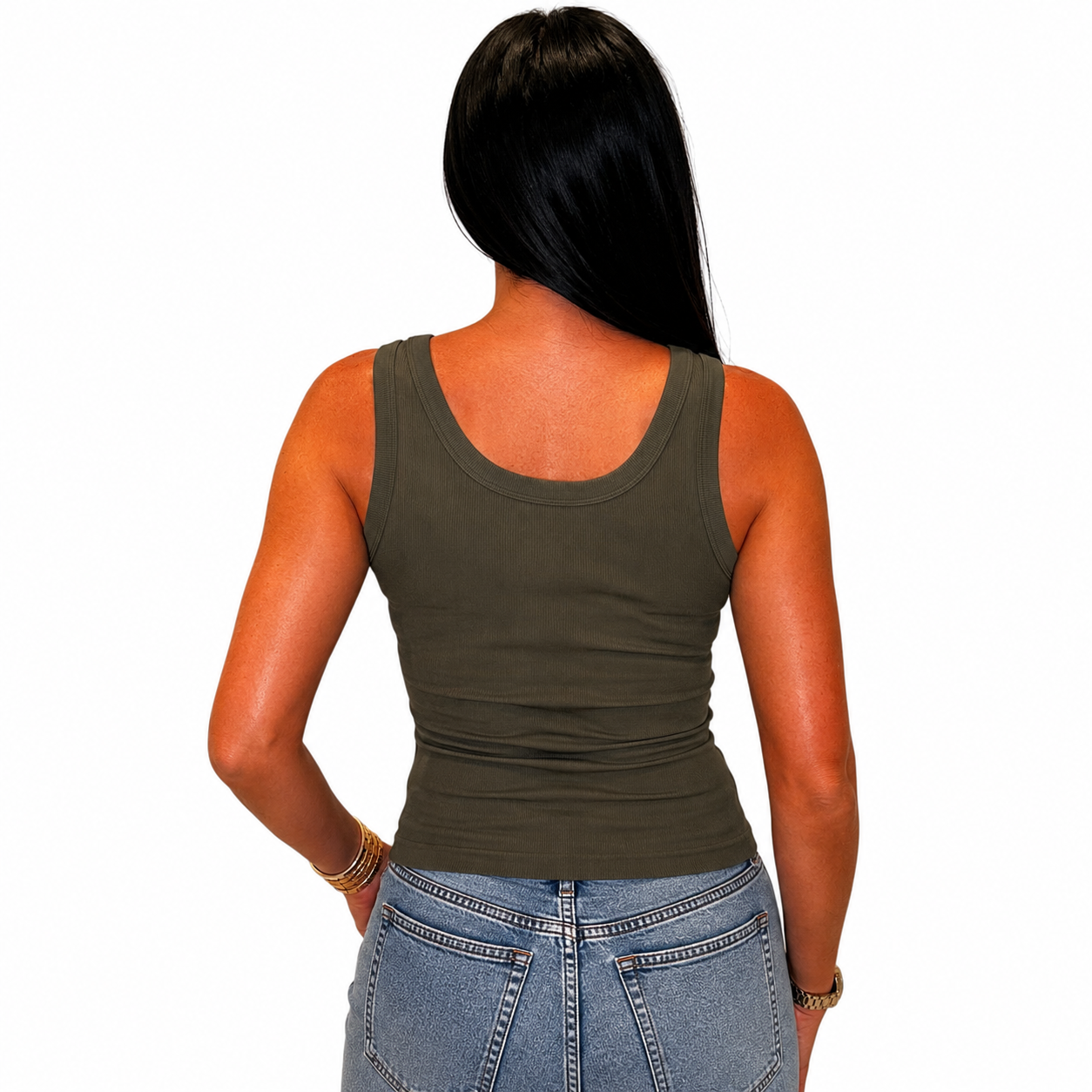 A woman shown from the back wearing a fitted sleeveless tank top in dark olive green, paired with light blue jeans, against a plain white background.