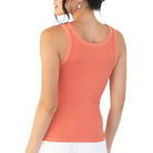 Coral tank top worn by a person on a white background