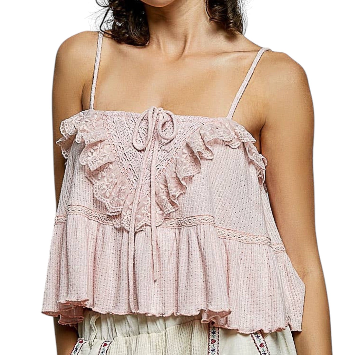 Pink lace top worn by a person on a white background