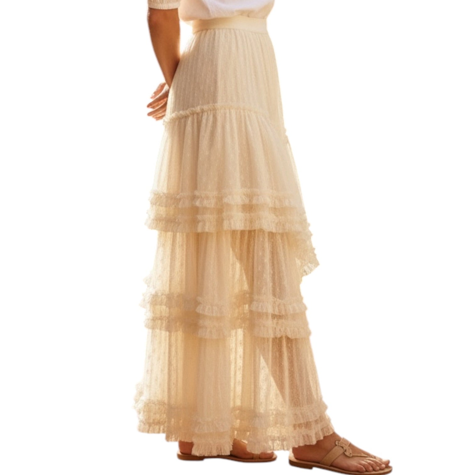 Beige tiered skirt worn by a person on a white background