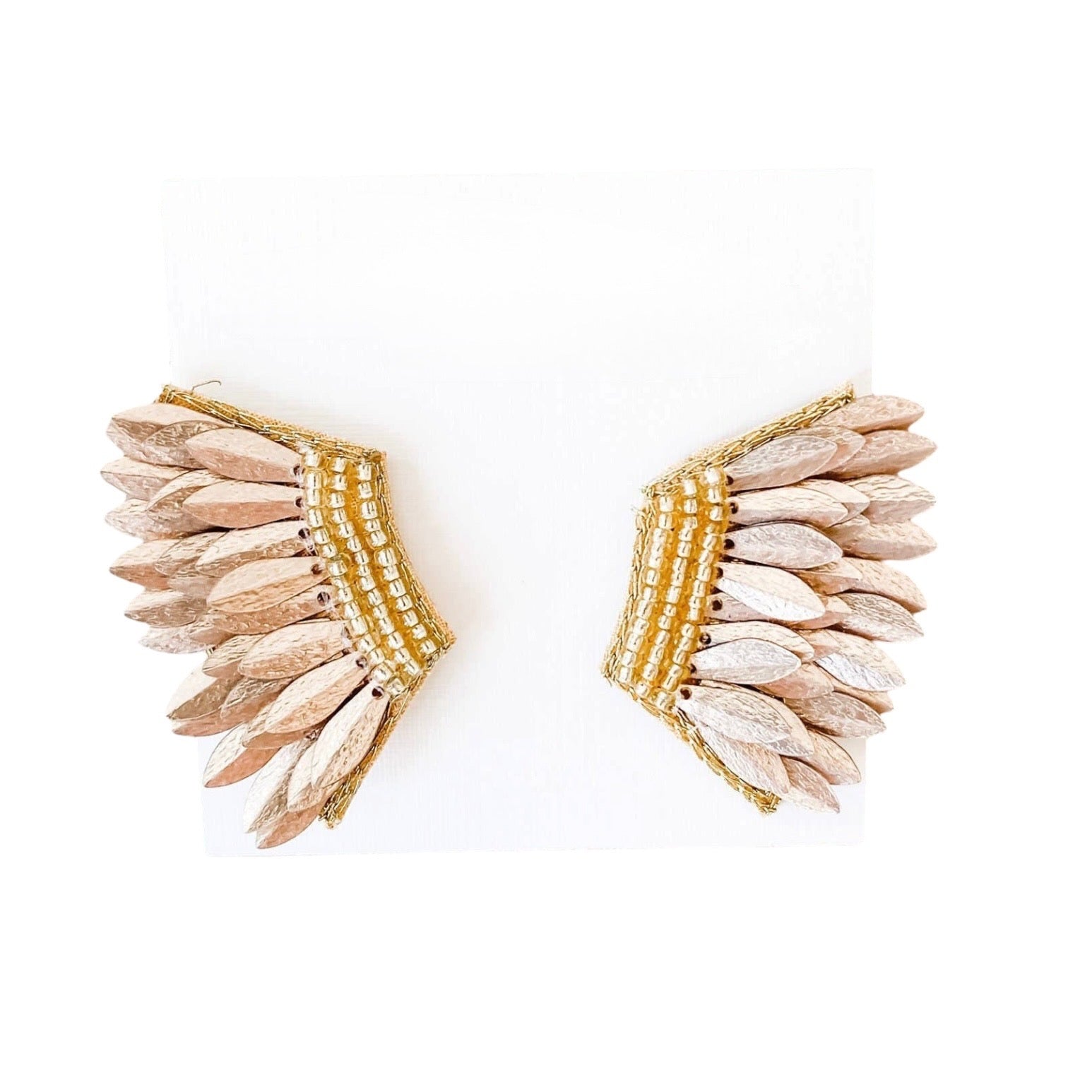 Pair of earrings with feather-like design and gold accents on a white background