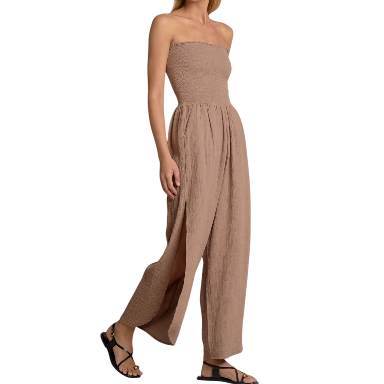 Beige strapless jumpsuit worn by a model on a white background