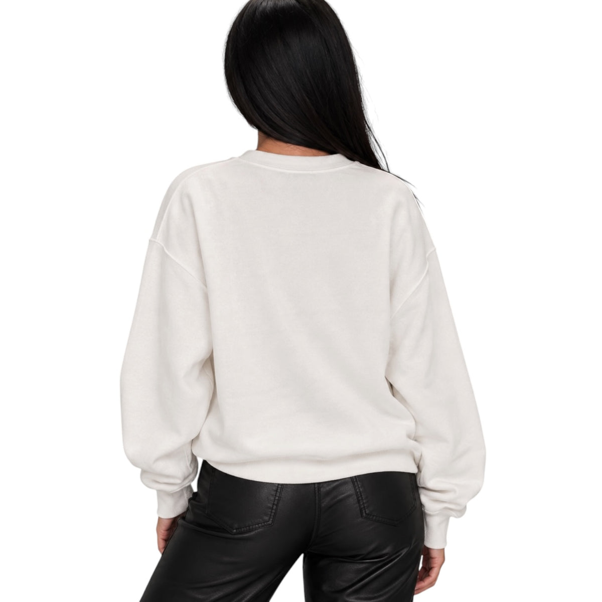 A woman viewed from the back wearing an off-white crewneck sweatshirt and black pants, set against a plain white background.