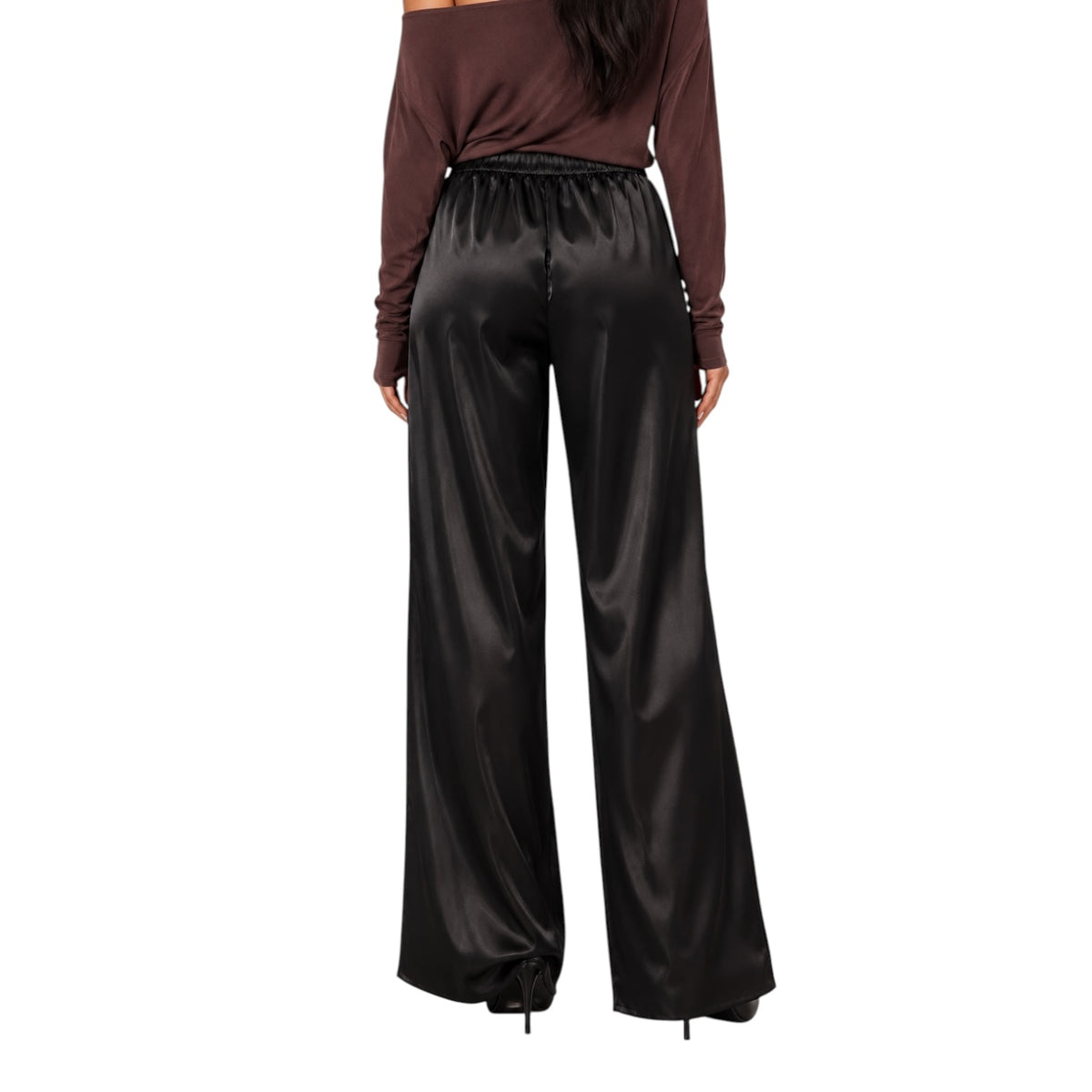 A model shown from the back wearing shiny black wide-leg satin pants and a dark brown off-the-shoulder top against a plain white background.