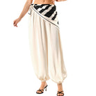 White pants with black and white striped top on a white background